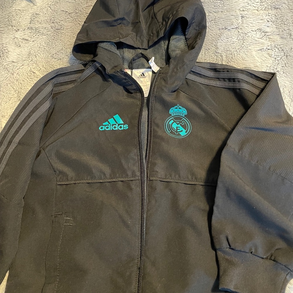 Adidas - Real Madrid track suit.